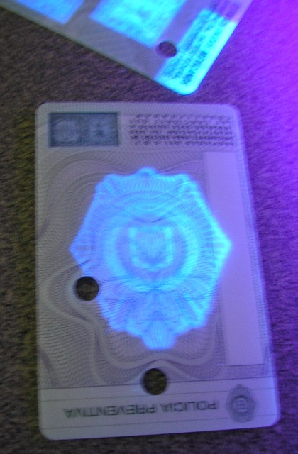 An ID uses UV-Visible ink as a quick verification
